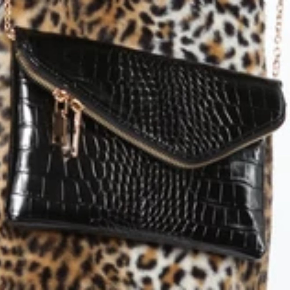 black purse with gold strap